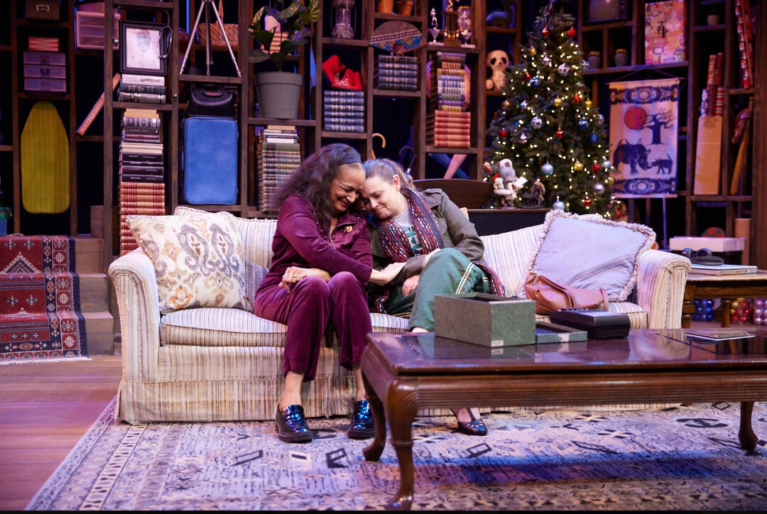 Dot laughs with her neighbor on Christmas Eve.